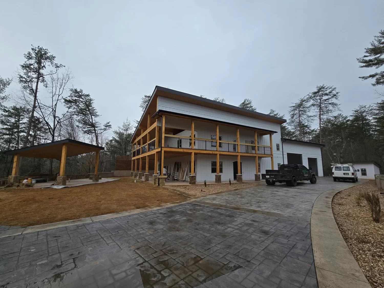 Completed CTech residential exterior with covered porch and timber details